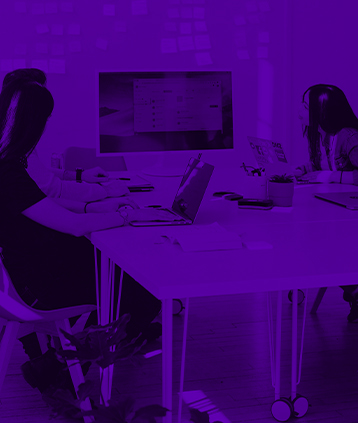 team discussing content on screen